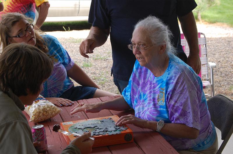 dsc_3227.jpg - shows Sierra and friend how to solve the puzzle.